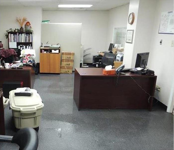 soaked, visible water on carpets, several desks,plus