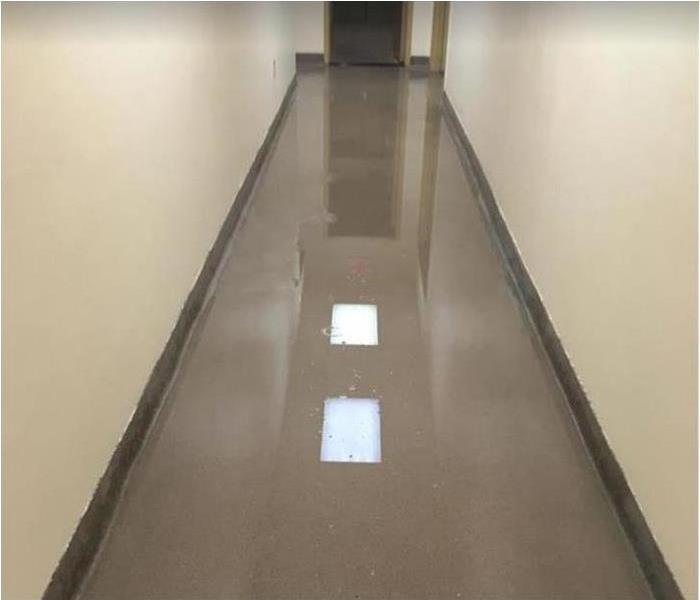 standing water in commercial building hallway
